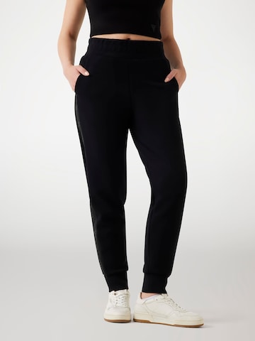 GUESS Tapered Pants in Black: front