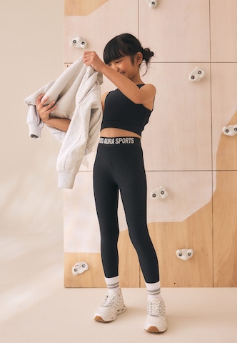 Skinny Leggings di Next in nero