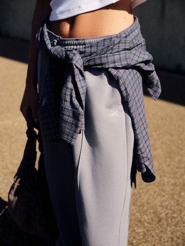 Wide leg Pantaloni sportivi di self. in grigio