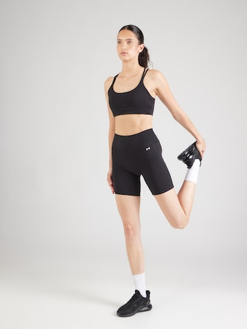 Skinny Pantalon de sport 'Motion' UNDER ARMOUR en noir