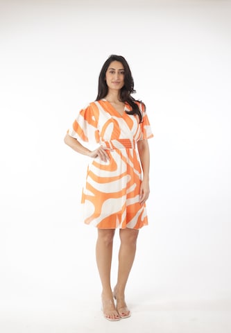 Elara Kjole i orange: forside