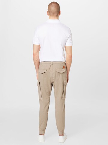 Effilé Pantalon cargo 'Airman' ALPHA INDUSTRIES en beige