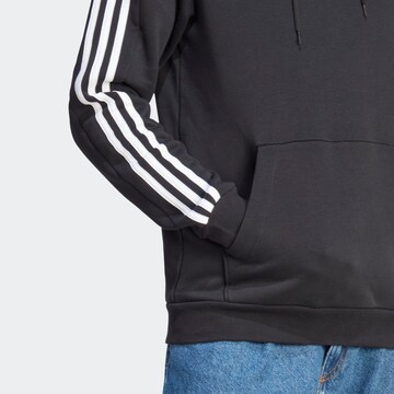 ADIDAS SPORTSWEAR Αθλητική μπλούζα φούτερ 'Essentials' σε μαύρο