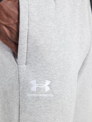 UNDER ARMOUR Tapered Urheiluhousut 'Essential' värissä harmaa