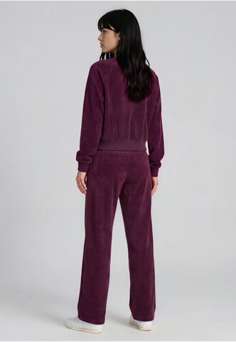 Regular Pantalon Karl Kani en violet : derrière