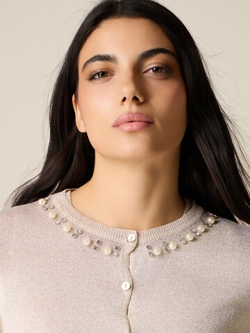 Cardigan oltre en or