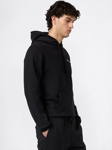 Champion Authentic Athletic Apparel Дънки Tapered Leg Панталон в черно: отпред