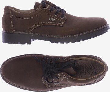 Rieker Flats & Loafers in 44 in Brown: front