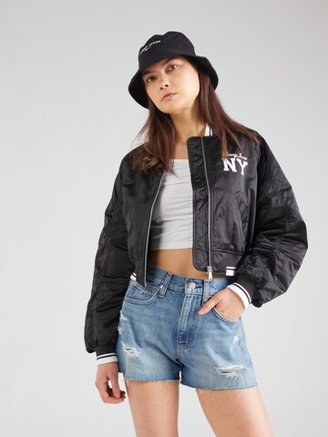 Tommy Jeans Between-Season Jacket 'VARSITY' in Black: front