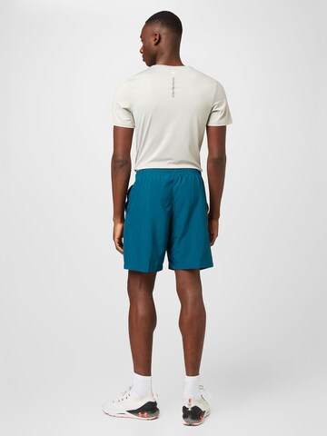 regular Pantaloni sportivi di UNDER ARMOUR in verde