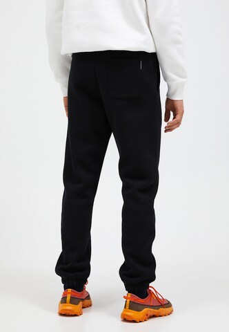 PEAK PERFORMANCE Regular Pants in Black