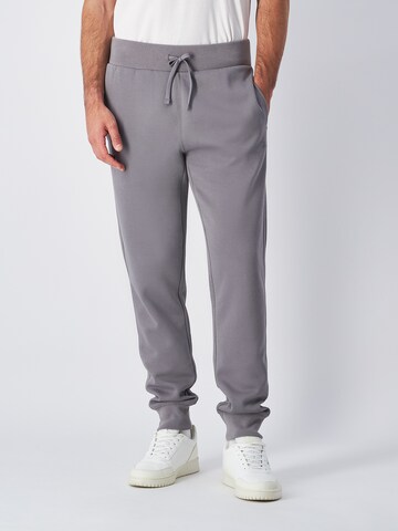 Champion Authentic Athletic Apparel Tapered Pants in Grey: front