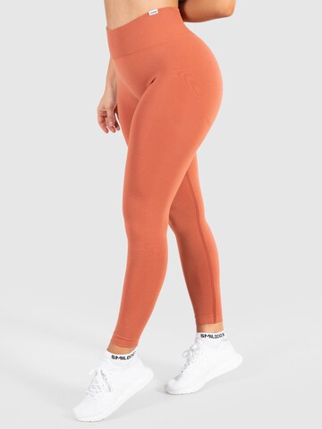 Smilodox Skinny Sportbroek 'Amaze Pro' in Oranje