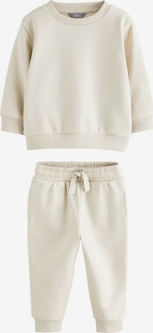 Next Juoksupuku värissä beige: etupuoli