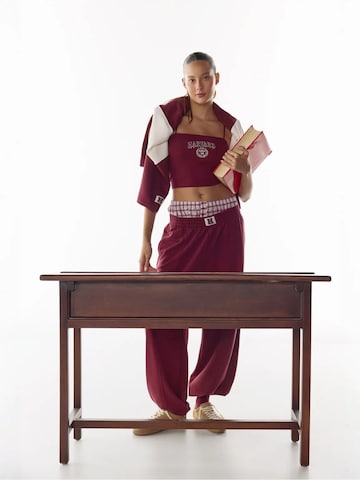 Penti Zwężany krój Spodnie sportowe 'Jogginghose' w kolorze czerwony