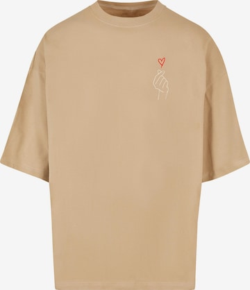 Merchcode Koszulka 'K Heart' w kolorze beżowy: przód