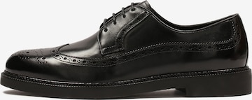 Kazar Lace-Up Shoes in Black: front