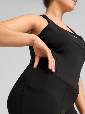 PUMA Skinny Sports trousers in Black