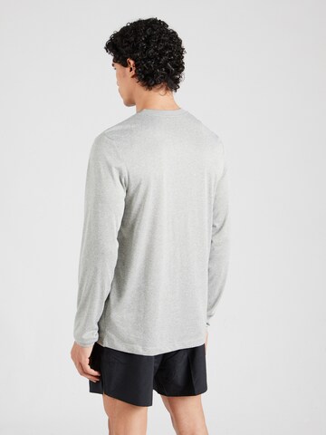 NIKE - Camiseta funcional en gris