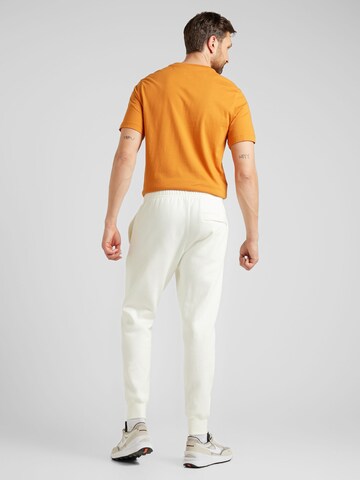 Tapered Pantaloni 'Club Fleece' de la Nike Sportswear pe bej