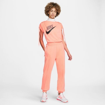 Nike Sportswear Tapered Broek in Oranje
