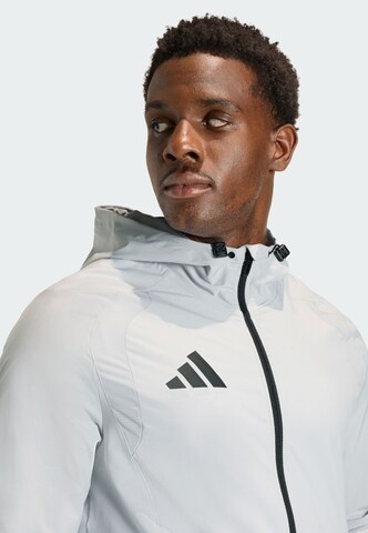 Veste de sport 'Tiro Travel' ADIDAS PERFORMANCE en gris