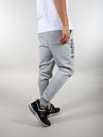 ALPHA INDUSTRIES Tapered Trousers in Grey