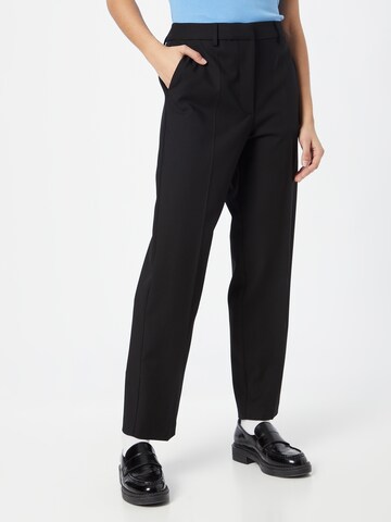 Loosefit Pantalon chino TOMMY HILFIGER en noir : devant