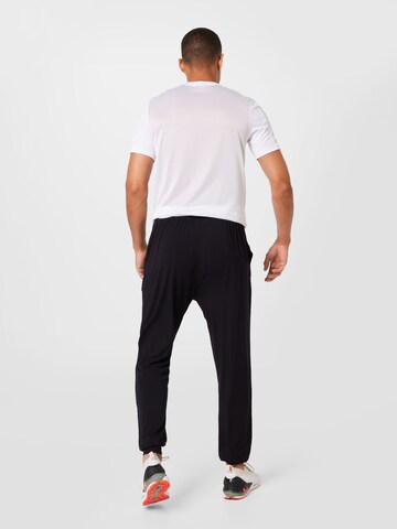 Effilé Pantalon de sport CURARE Yogawear en noir