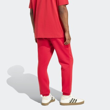 ADIDAS SPORTSWEAR Tapered Workout Pants in Red
