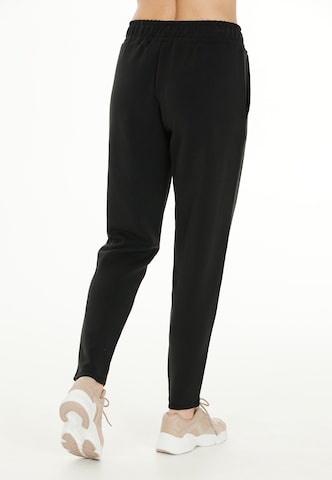 Athlecia Tapered Sporthose in Schwarz