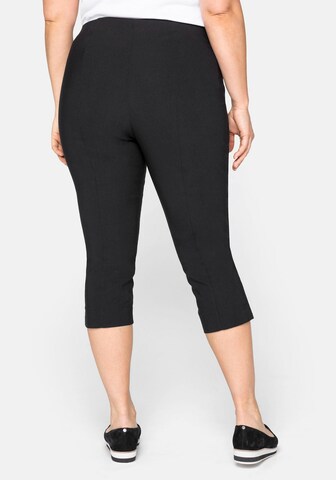 SHEEGO - Slimfit Pantalón en negro