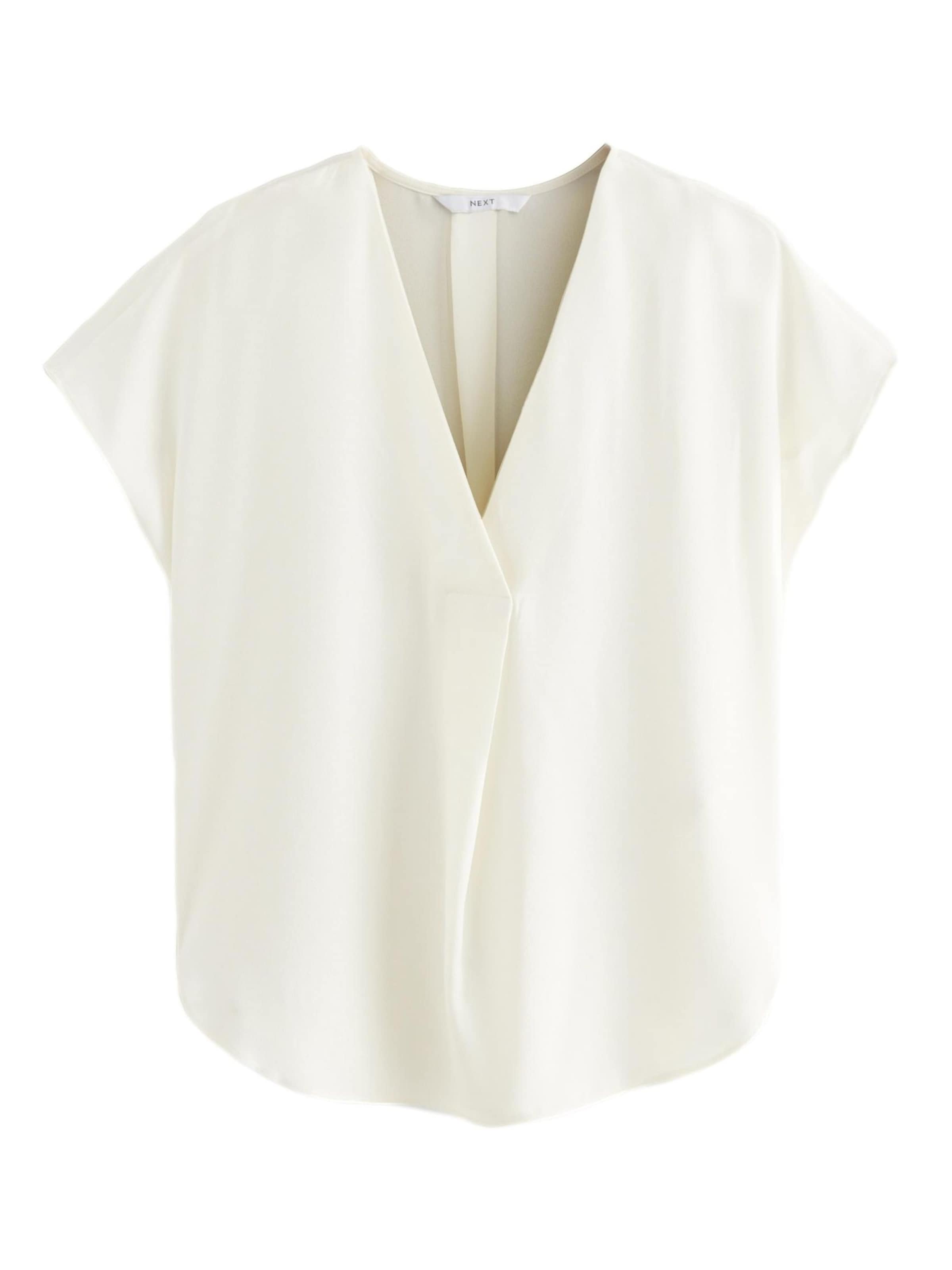 Next Blus i beige: framsida