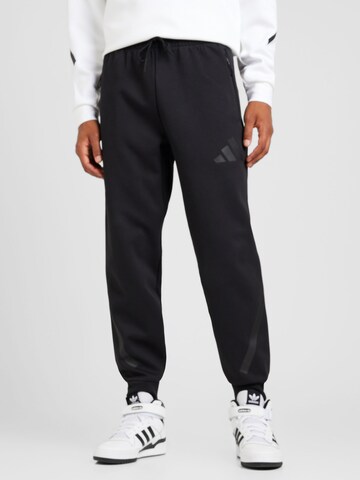 ADIDAS SPORTSWEAR Tapered Παντελόνι φόρμας 'Z.N.E.' σε μαύρο: μπροστά