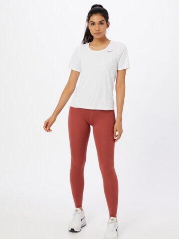 NIKE Skinny Urheiluhousut värissä ruskea