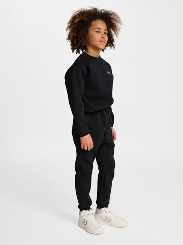 Effilé Pantalon de sport Hummel en noir