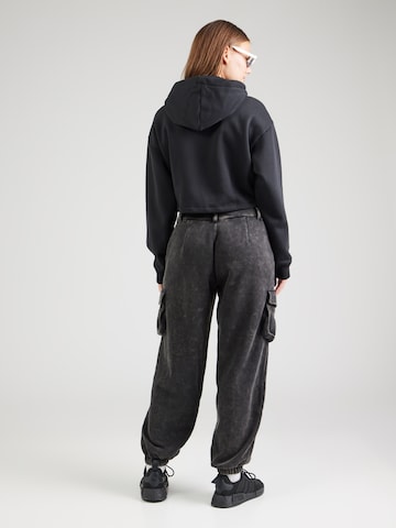 Tapered Pantaloni cargo di ADIDAS ORIGINALS in nero