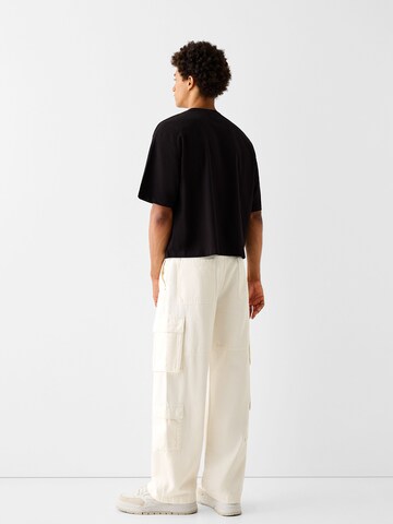 Bershka Loose fit Cargo trousers in White