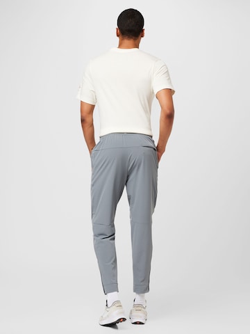 NIKE Tapered Workout Pants 'UNLIMITED' in Grey