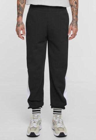 Urban Classics Loose fit Pants in Black: front