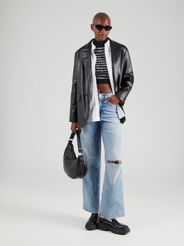 Tops en tricot Tommy Jeans en noir