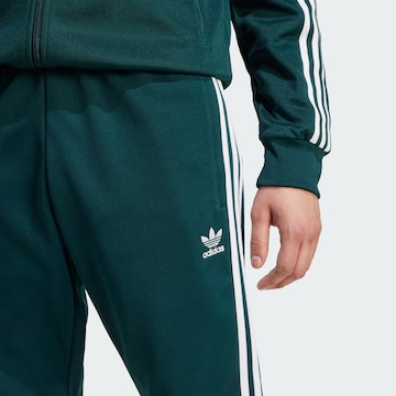 ADIDAS ORIGINALS Tapered Trousers in Green