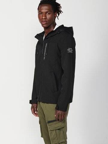 KOROSHI Välikausitakki värissä musta