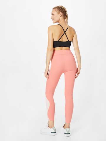 PUMA Skinny Sports trousers in Pink