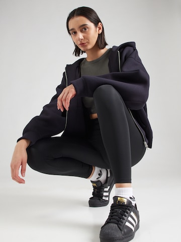Skinny Leggings 'ESS' di ADIDAS ORIGINALS in nero