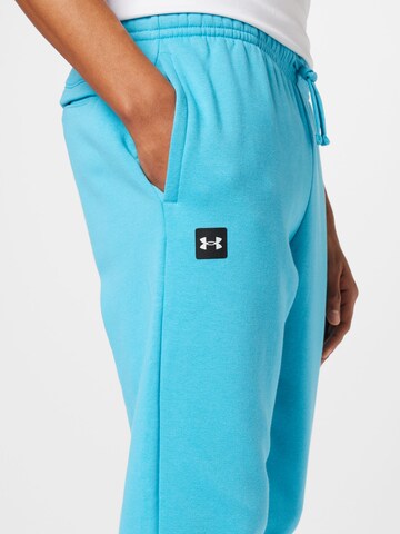 Effilé Pantalon de sport 'Rival' UNDER ARMOUR en bleu