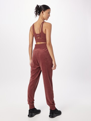 Nike Sportswear Tapered Pleat-Front Pants in Brown