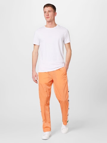 Loosefit Pantalon Tommy Jeans en orange