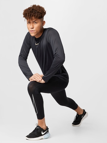 NIKE Skinny Sporttrosa i svart