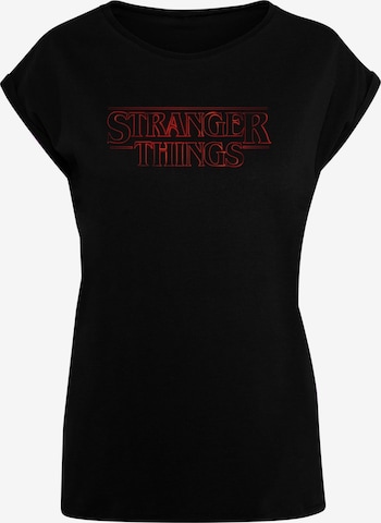 ABSOLUTE CULT T-Shirt 'Stranger Things - Glow' in Schwarz: predná strana
